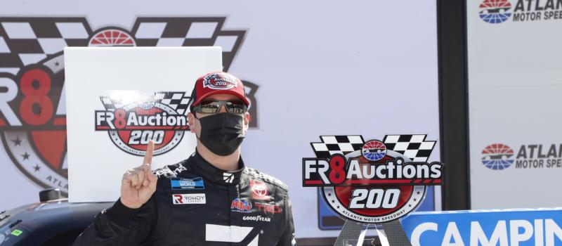 Kyle Busch celebrates his victory in the Fr8Auctions 200.