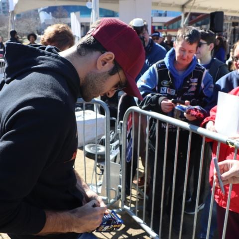 Chase Elliott signs autographs at the World of Coca-Cola on Feb. 7, 2024.