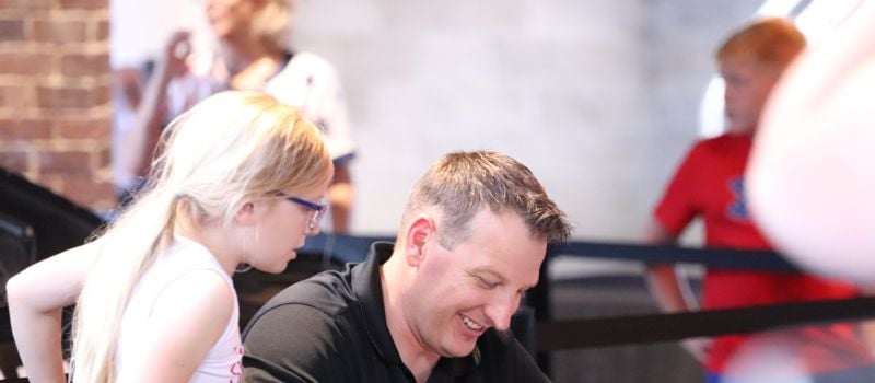 Michael McDowell signing autographs for fans.