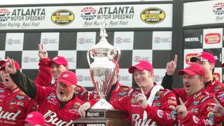 Dale Earnhardt Jr. celebrates the 2004 win with his pit crew.