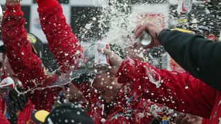 A shower of celebration surrounded Dale Earnhardt Jr. in 2004.