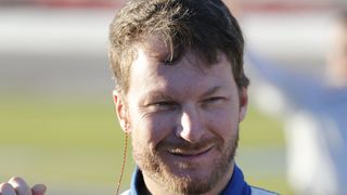 Dale Earnhardt Jr. pauses before getting in his car before the 2017 Folds of Honor QuikTrip 500 at Atlanta Motor Speedway.